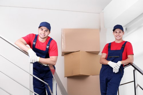 Packed office boxes and furniture ready for transport