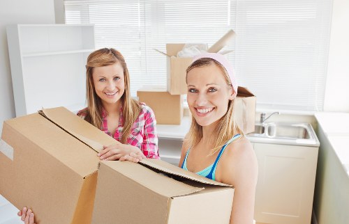 House moving team arranging boxes and furniture after a Streatham relocation