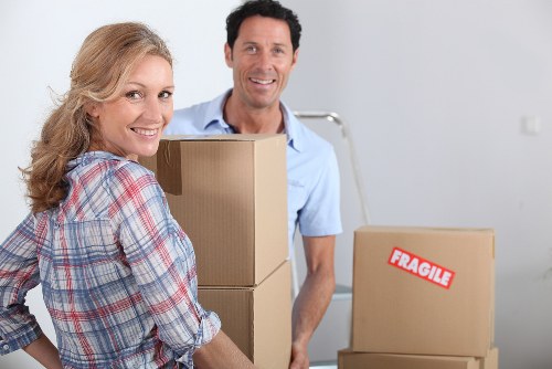 Careful wrapping of fragile household items during a move in Streatham