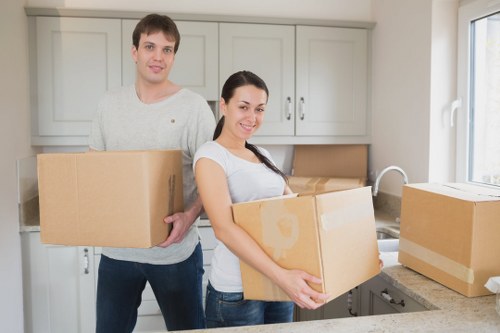 Movers loading household items for a south London relocation